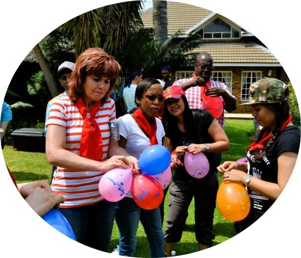 team holding balloons